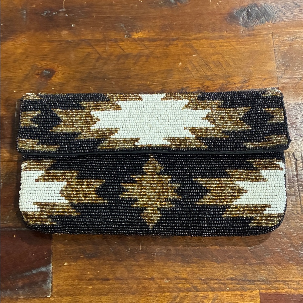 From St Xavier aztec beaded evening clutch
